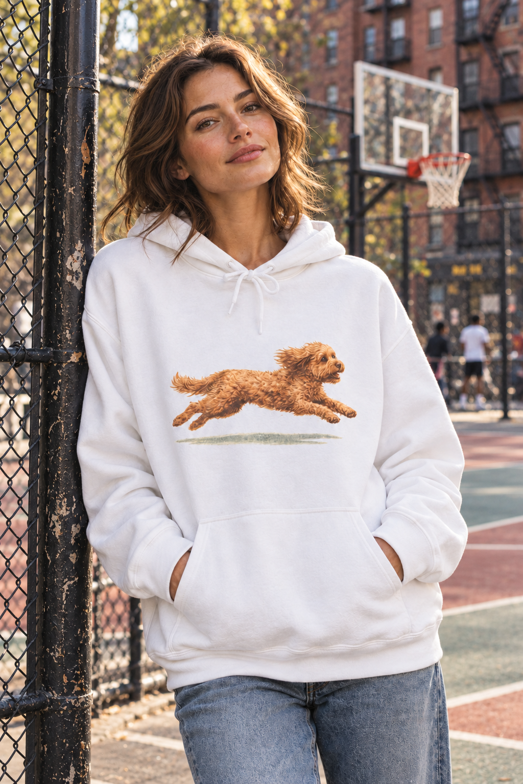 White Barksy running dog hoodie beside a New York basketball court